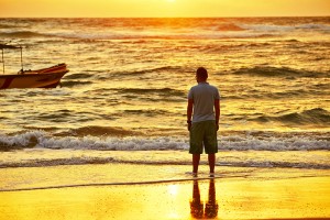 Sunset man on beach